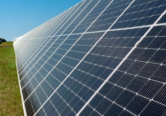 An image of solar panels in a field
