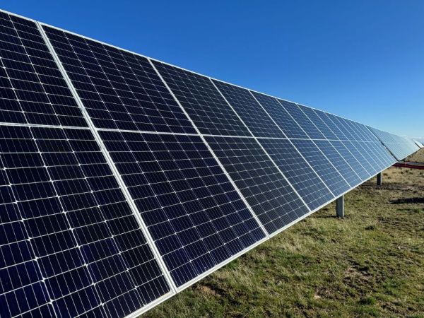Image of solar panels and blue sky.