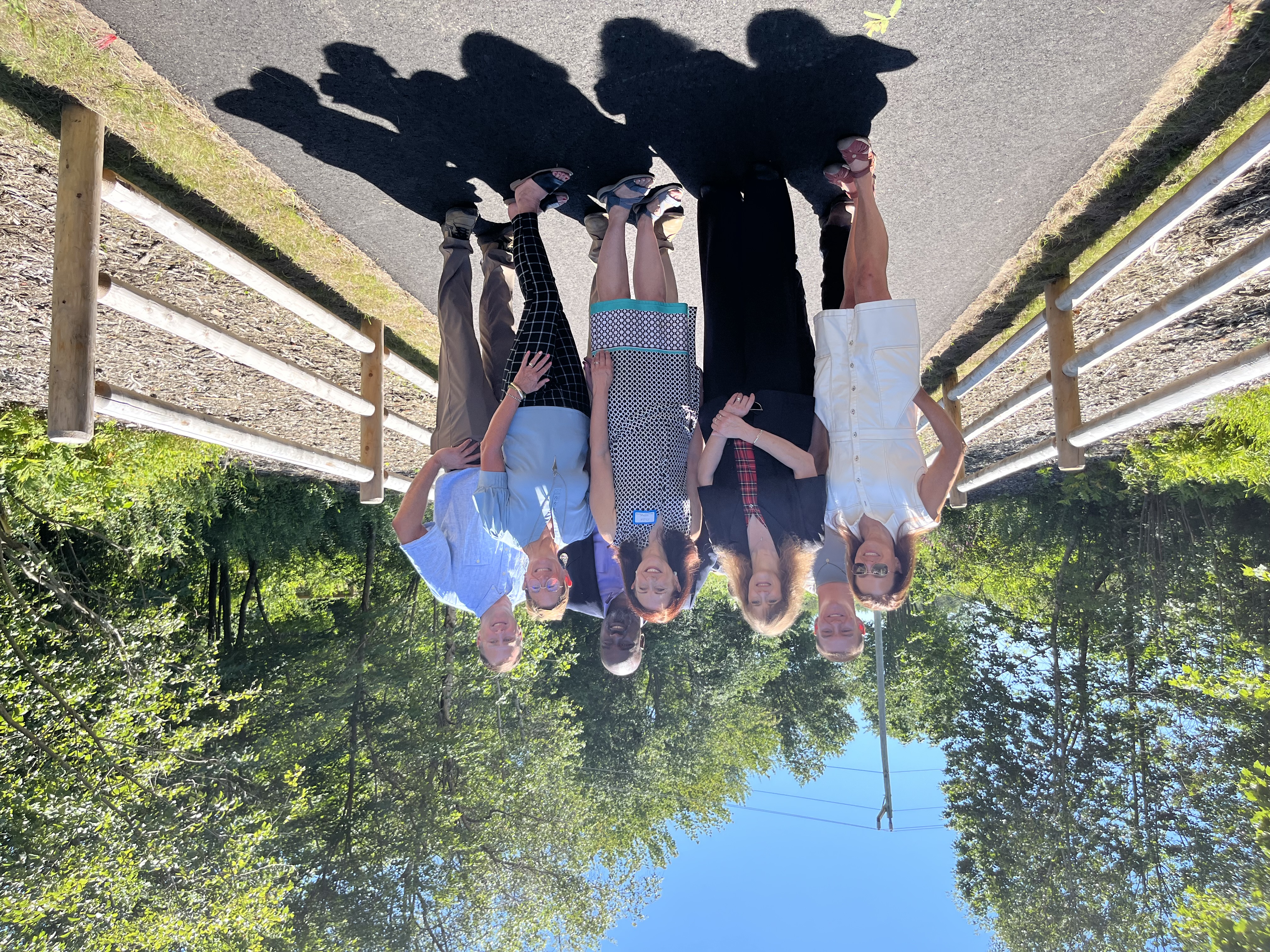 A group of people standing on the new part of Eastern Trail in South Portland, Maine.